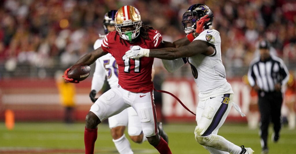 49ers wide receiver Brandon Aiyuk (11) runs with the ball next to Baltimore Ravens linebacker Patrick Queen (6) in the fourth quarter at Levi's Stadium.